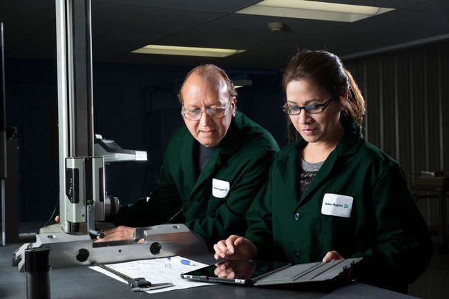 Employees doing a quality test on machinery